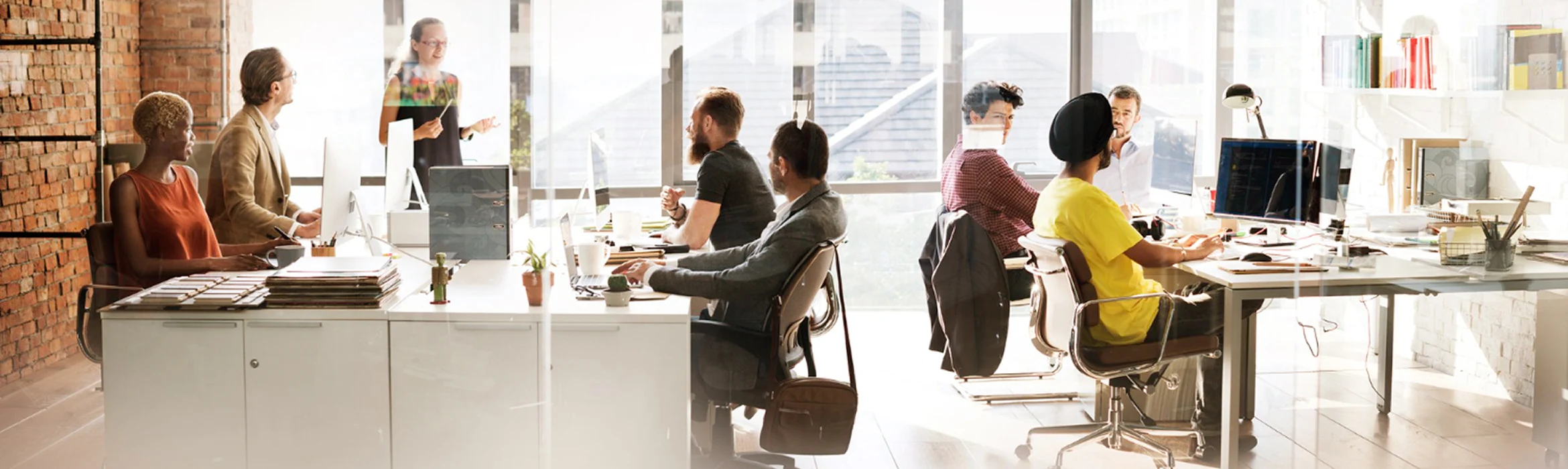 Screenshot of the Feature Management page in Microsoft Dynamics 365 Business Central showing a list of feature updates, including columns for feature name, version availability, enablement status, and current company status. Several features are available to "Try it out" or are marked as "Enabled" for "All Users" in version 27.0, part of 2025 Release Wave 2.