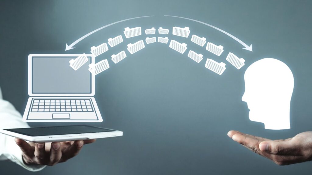 ERP knowledge transfer in manufacturing illustrated by a digital concept showing data folders moving from a laptop to a human head, symbolizing the sharing of business process expertise and system knowledge.