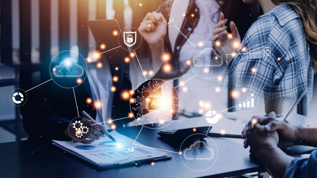 Business team reviewing analytics with digital AI, cloud, and data security icons overlaid, representing modern data strategy and intelligent automation.